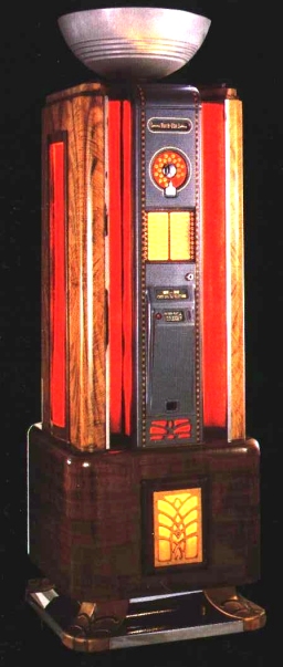 Rock-Ola 'Spectravox'    Année 1941    Production 3.000 u.

Rock-Ola innove et surprend avec la sortie de ce jukebox stylisé Art-Déco. La mécanique est placée dans un cabinet séparé appelé ‘ playmaster ‘

Très rare, cette cabine de téléphone façon lampadaire est la plus haute et la Production 3.000 u.      plus chère du marché des jukeboxes de collection.

* Certainement aussi bien un bon investissement qu’un bon placement.